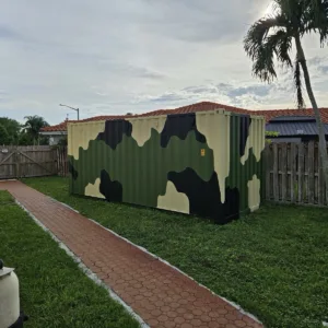 Camouflage shipping container for secure outdoor equipment storage