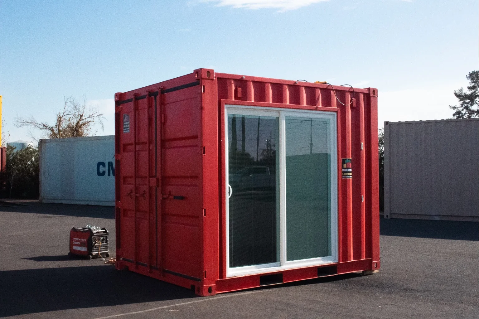 Portable container concession stand with sliding glass entry door