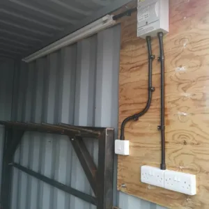 Weather-resistant steel storage container with marine plywood flooring