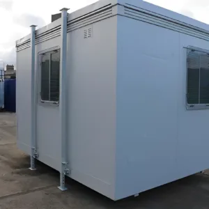 Portable construction site office cabin with heating and lighting installed