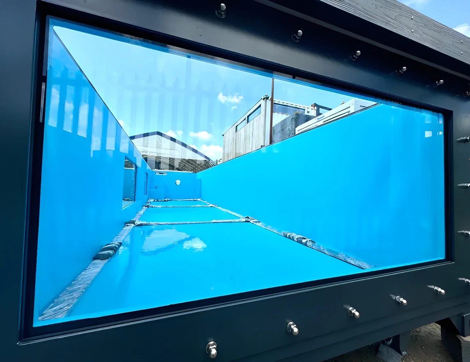 Portable container pool with automated water treatment and filtration system