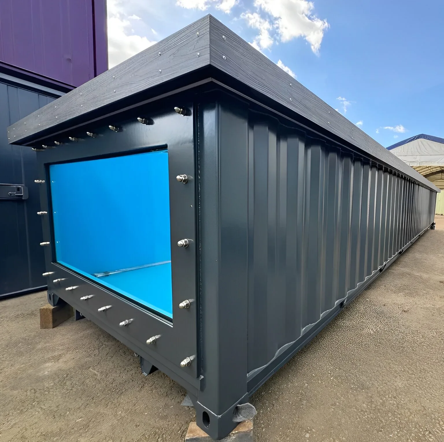 Modern shipping container swimming pool with tempered glass windows
