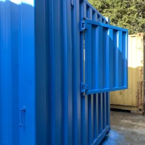 Shipping container café kiosk with stainless steel sink and electrical setup