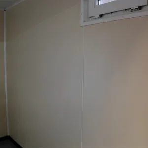 Portable site office with toilet, lighting, and electrical installation