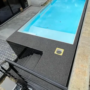 Custom 20ft container pool with built-in steps and seating bench