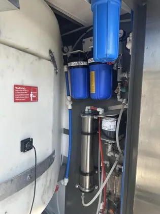 Lightly used Kooler Ice IM1500 self-service ice and water kiosk