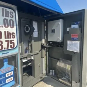 Self-service ice vending machine with purified water dispensing system