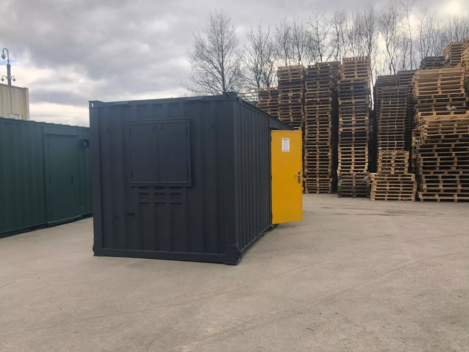 Secure anti-vandal office container with fitted electrical installation and lighting