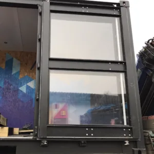 Modified 20ft container with large glass windows and secure steel construction