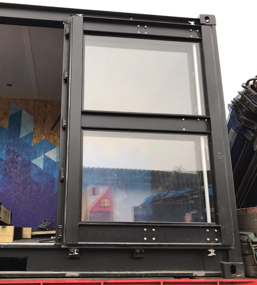 Modified 20ft container with large glass windows and secure steel construction