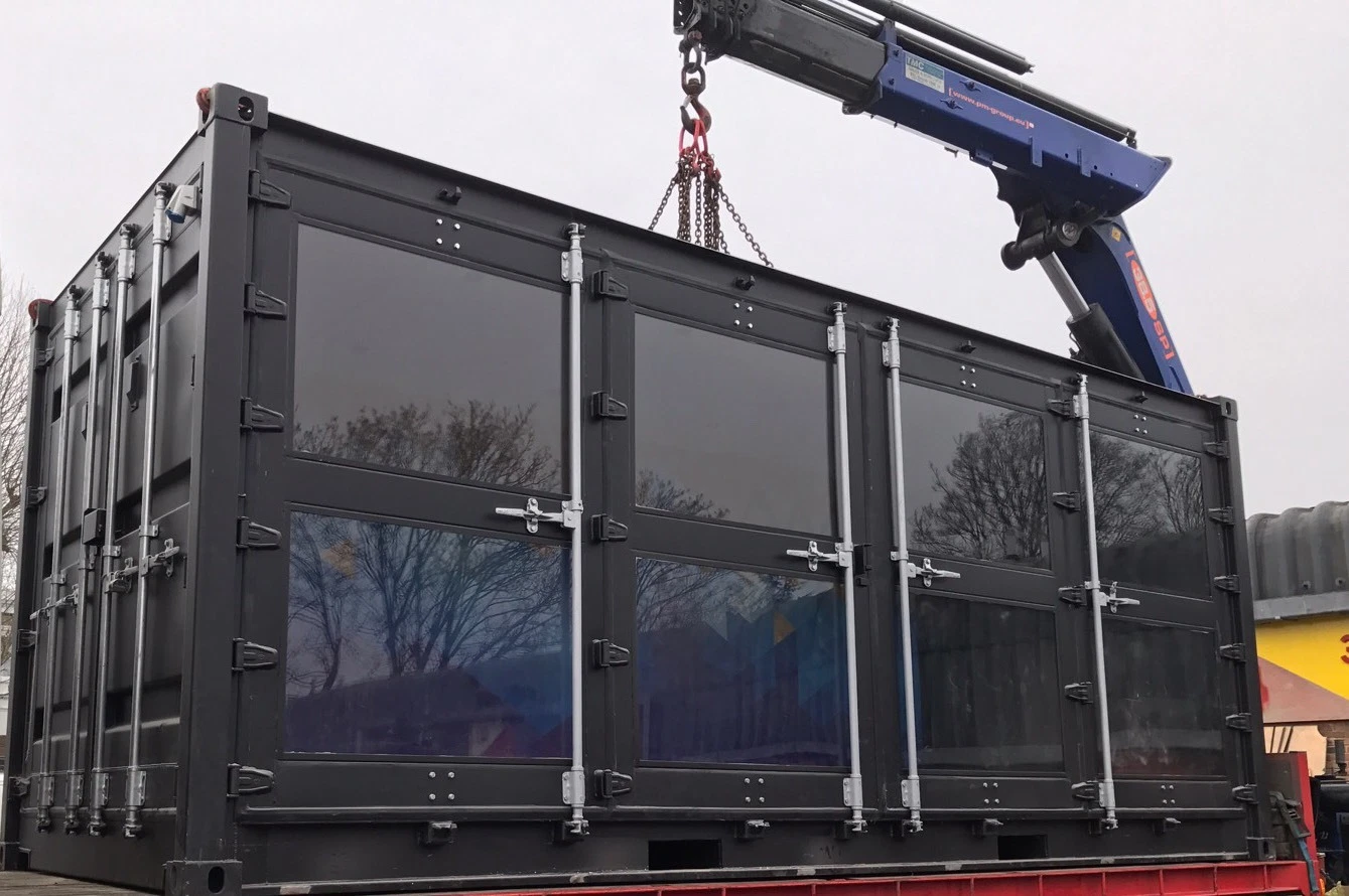 Secure 20ft storage container with framed glass windows and ventilation system