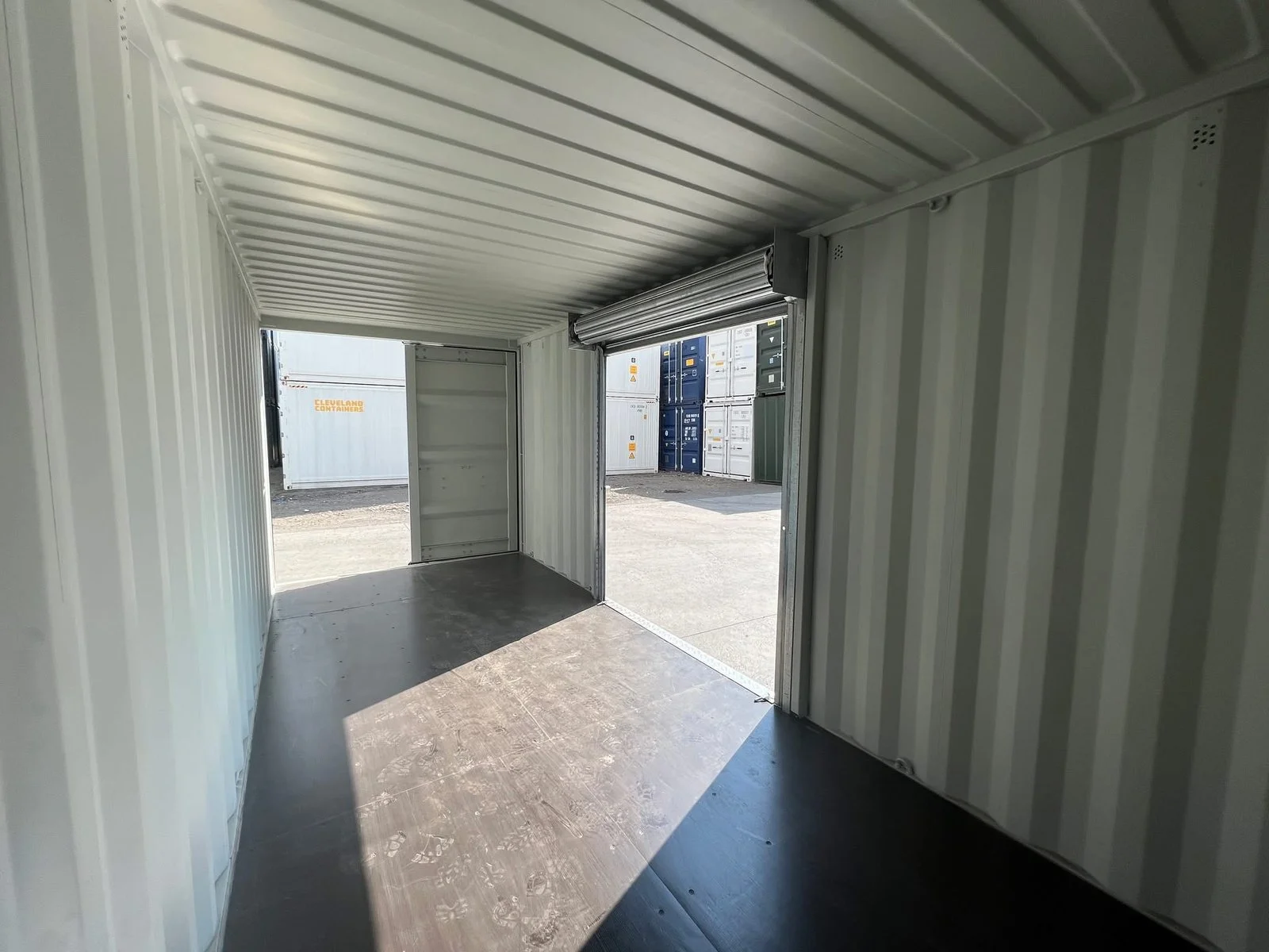 Refurbished 20ft shipping container with roller shutter access for commercial storage