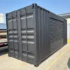 20ft Shipping Container – Matte Black With 12ft Side Roll-Up Door
