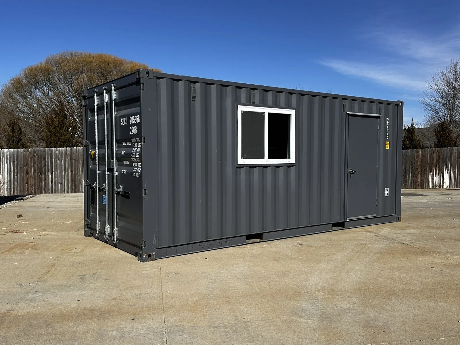 20ft shipping container office with slate gray shiplap interior and mini split HVAC
