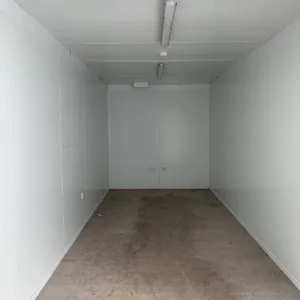 Insulated storage container with double cargo doors and marine plywood floor