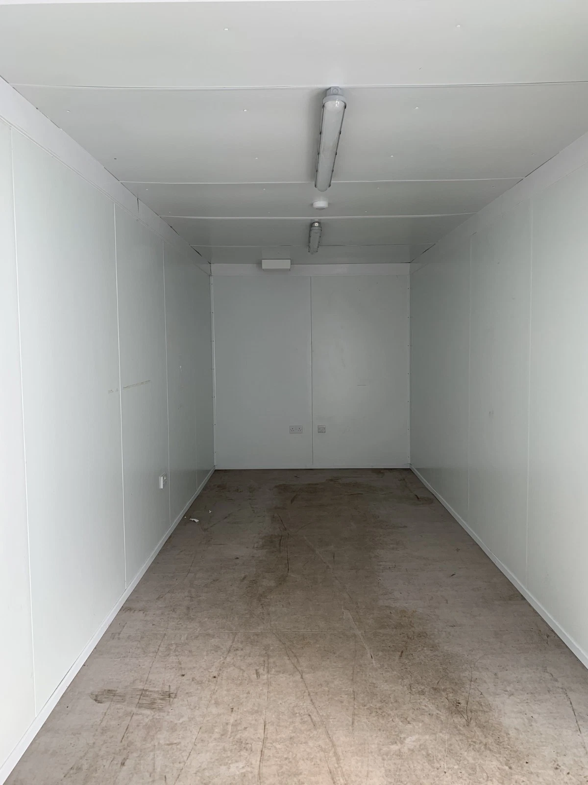 Insulated storage container with double cargo doors and marine plywood floor