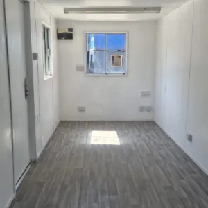 Green office shipping container with insulated interior and LED lighting
