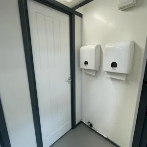 Modular toilet block built from a 20ft corten steel shipping container
