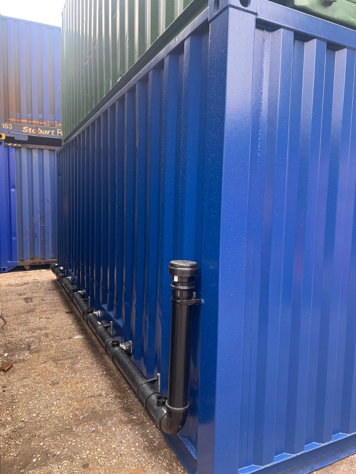 Portable sanitation container with ceramic toilets, urinals, and washbasins