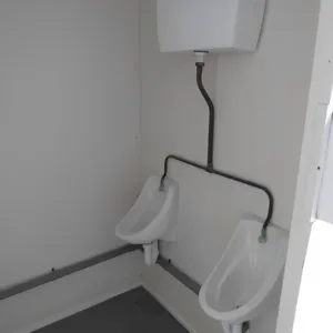 Anti-vandal steel toilet cabin with urinals, toilets, and hand wash basins
