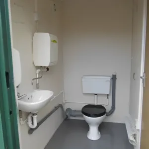 Heavy-duty steel toilet cabin with insulated walls and electric heating