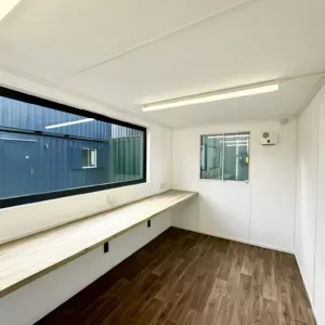 Site cabin office with large glazed windows and anti-slip flooring