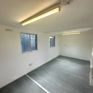 Portable anti-vandal office cabin with electric heating and secure steel doors