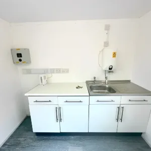 Construction site welfare cabin with office space and self-contained toilet facility
