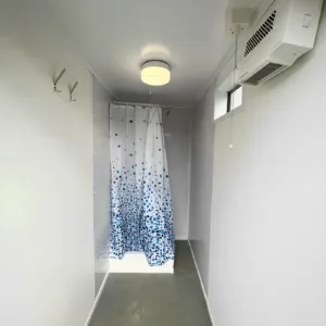 Secure portable restroom and shower unit for remote work locations