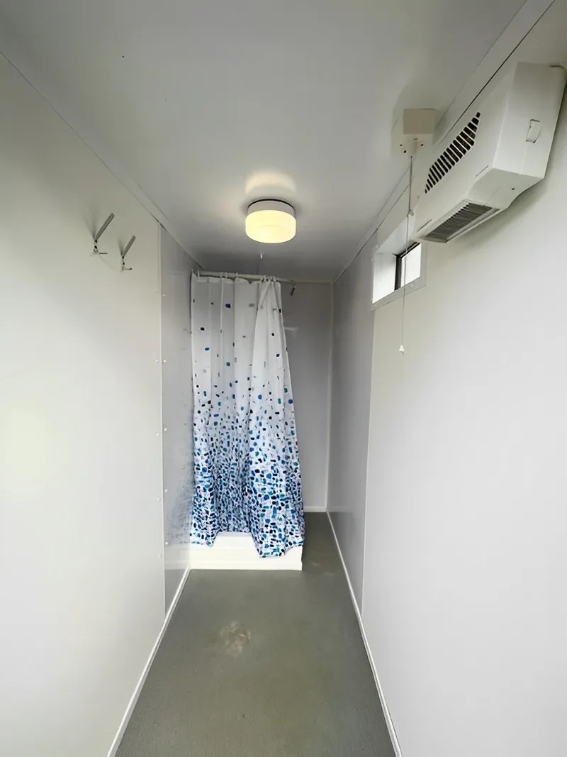 Secure portable restroom and shower unit for remote work locations