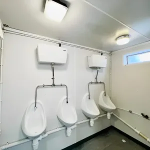 Portable sanitation block with secure steel doors and ventilation system