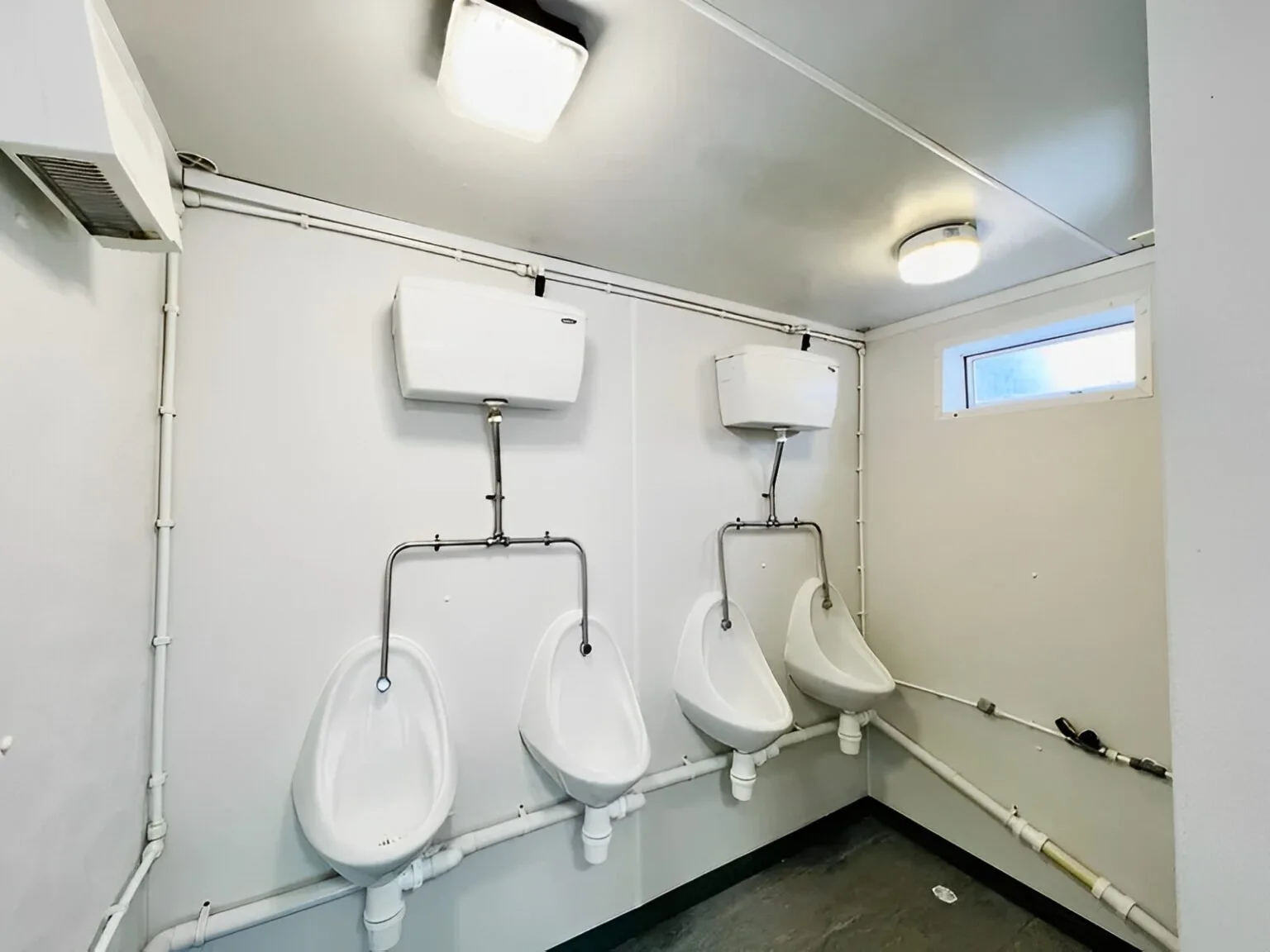 Portable sanitation block with secure steel doors and ventilation system