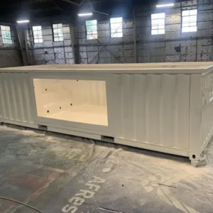 Custom 30ft container pool with glass viewing panel and LED lighting