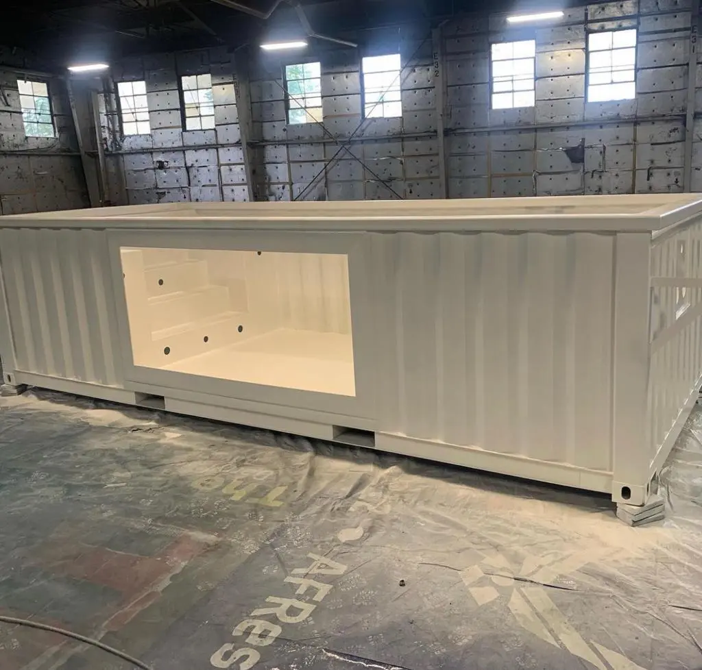 Custom 30ft container pool with glass viewing panel and LED lighting