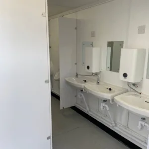 16ft x 9ft portable toilet cabin with toilets, urinals, and wash basins