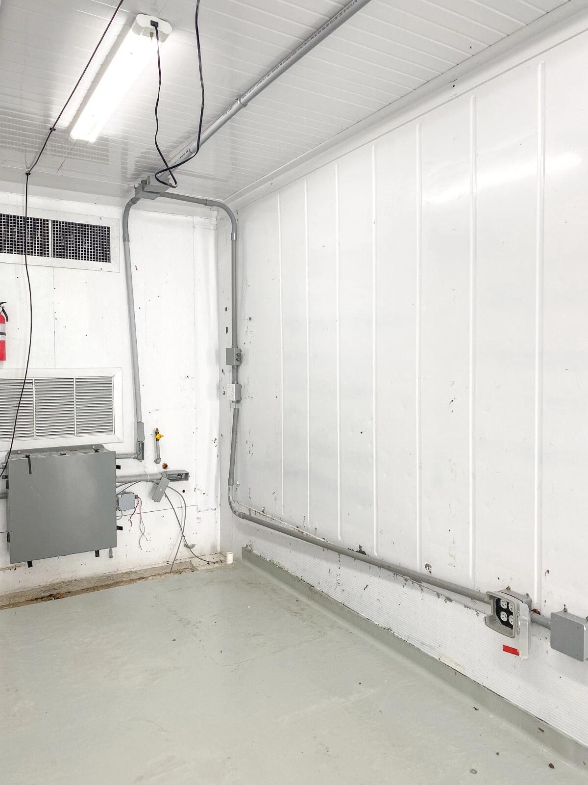 Modified 40ft high cube container with HVAC, epoxy flooring, and electrical installation