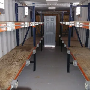 Climate-controlled shipping container office with inventory storage system