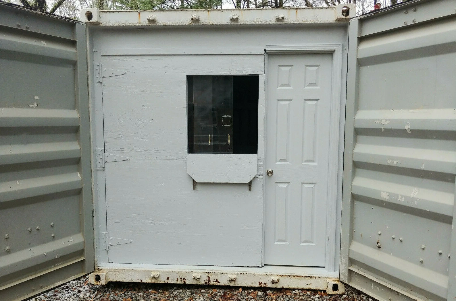 40ft modified shipping container with workbench, electrical panel, and racking