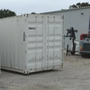 Commercial container shop with lockable access door and storage shelving