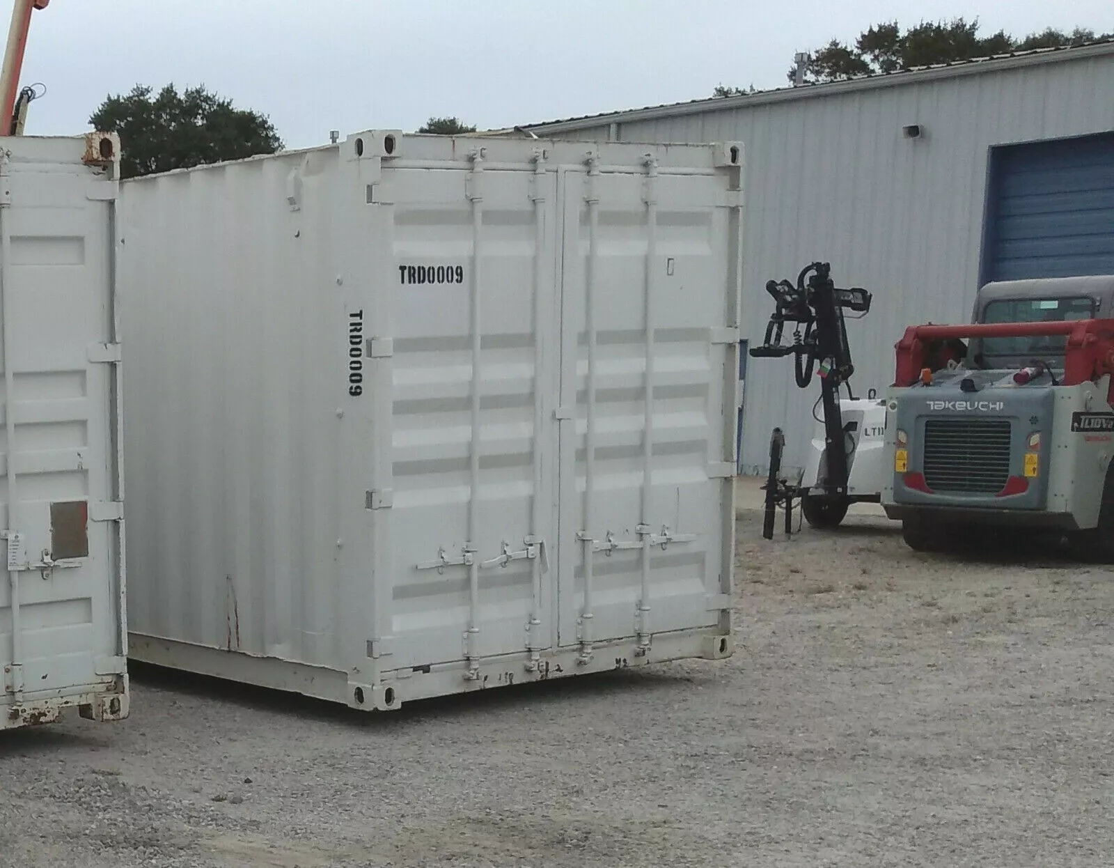 Commercial container shop with lockable access door and storage shelving