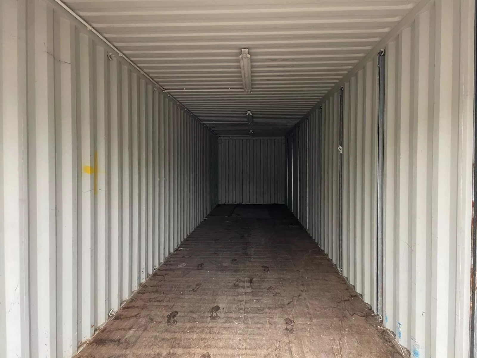 Wind and watertight 40ft shipping container with roll-up garage-style door