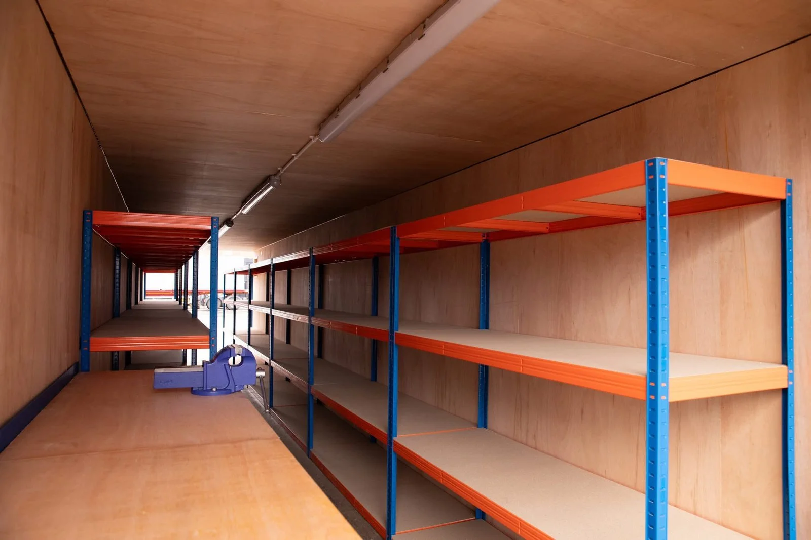 Fully shelved 40ft mobile workshop container for tools and equipment storage
