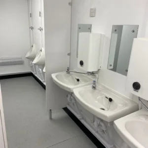 Anti-vandal toilet cabin with extractor fans and insulated interior walls
