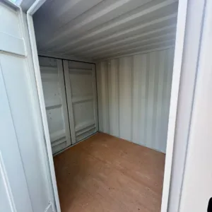Compact 7ft storage container with window for natural interior lighting