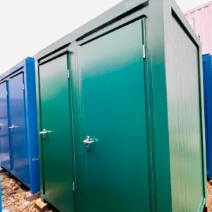 Portable restroom cabin with mains connection and powder-coated steel walls