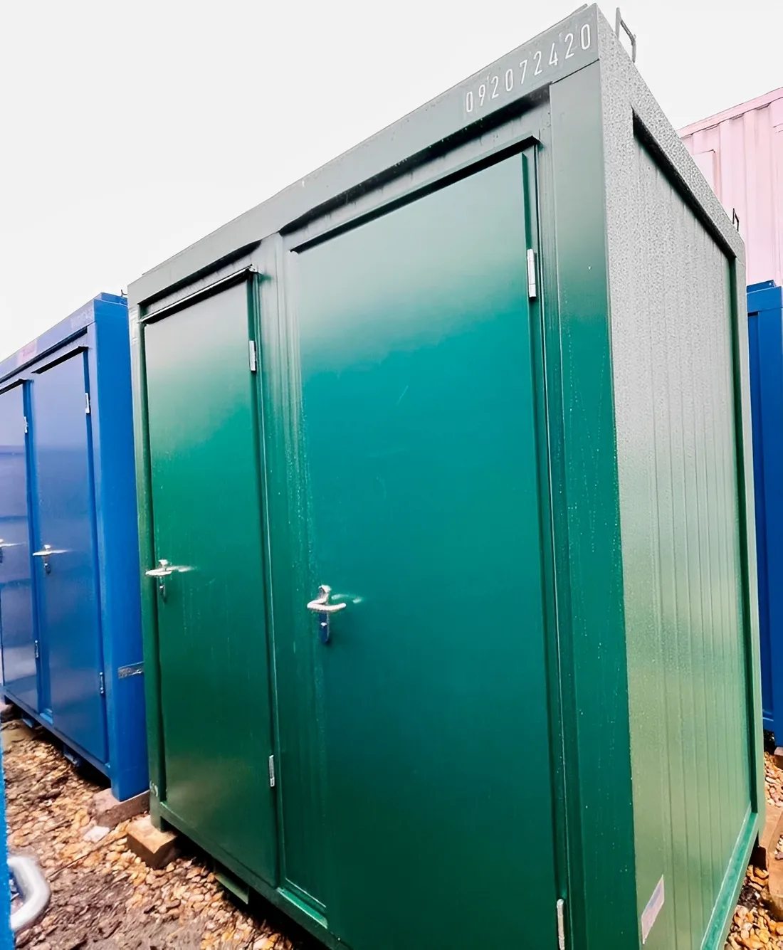 Portable restroom cabin with mains connection and powder-coated steel walls