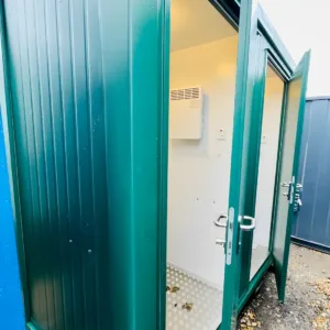Insulated portable toilet cabin with two toilets and hand wash basins