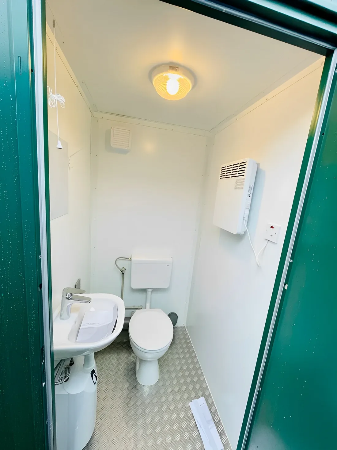 Double WC toilet block with aluminium flooring and steel entrance door