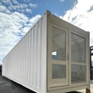 Open-plan container office with glazed end panels and secure steel construction