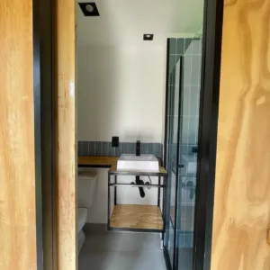 Modern tiny home built from a 20ft shipping container with cozy cabin finish